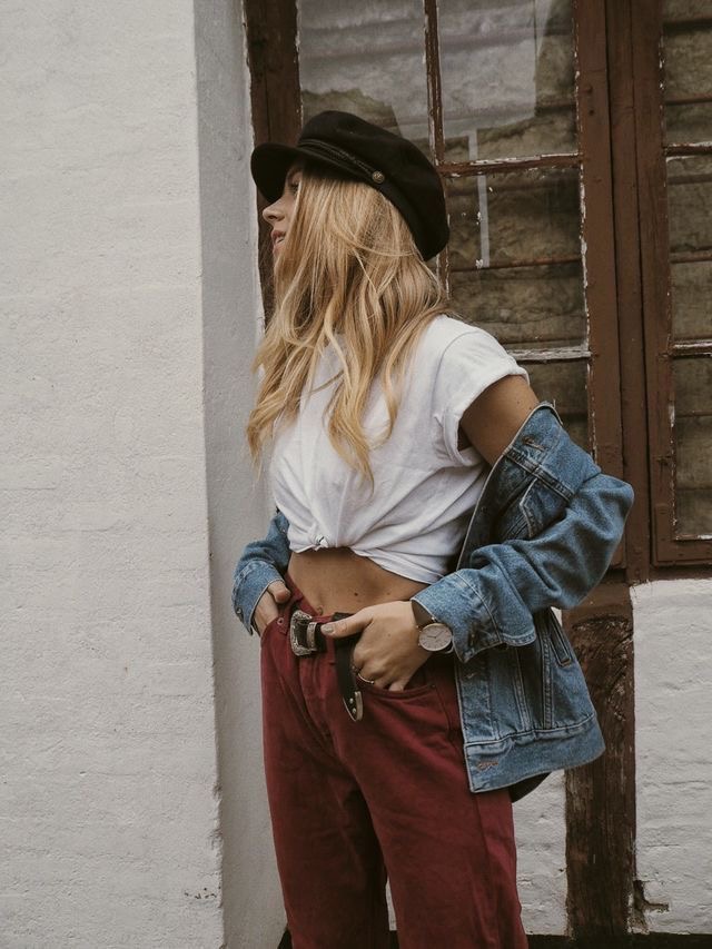 girl wearing a baker boy hat in fall