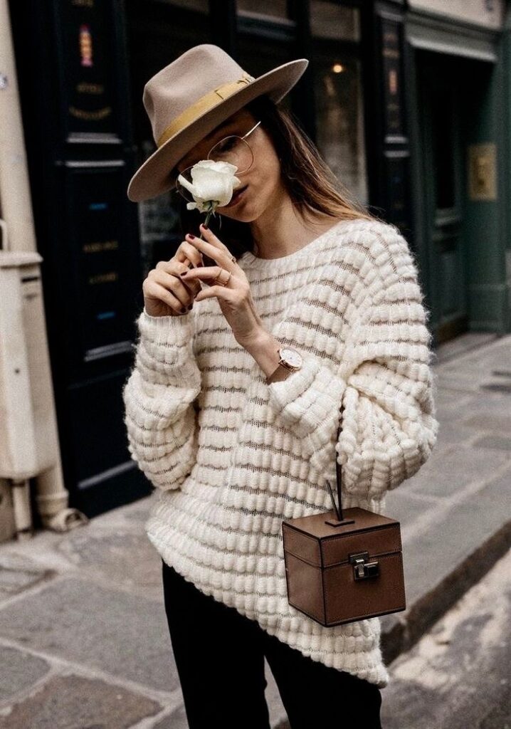 girl wearing a fedora in fall