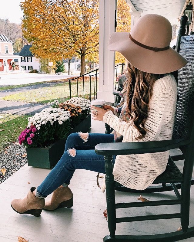 girl wearing a floppy wide-brimmed hat in fall