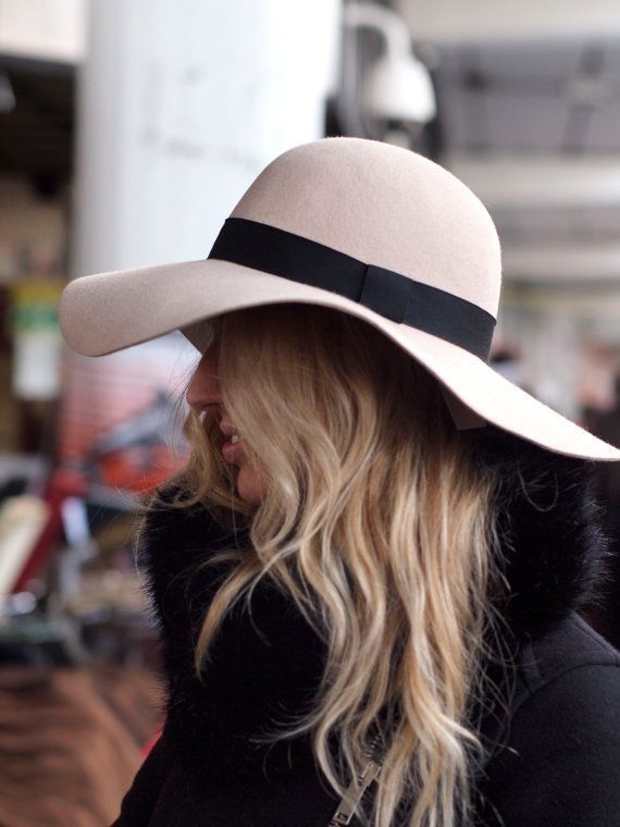 girl wearing a floppy wide-brimmed hat in fall