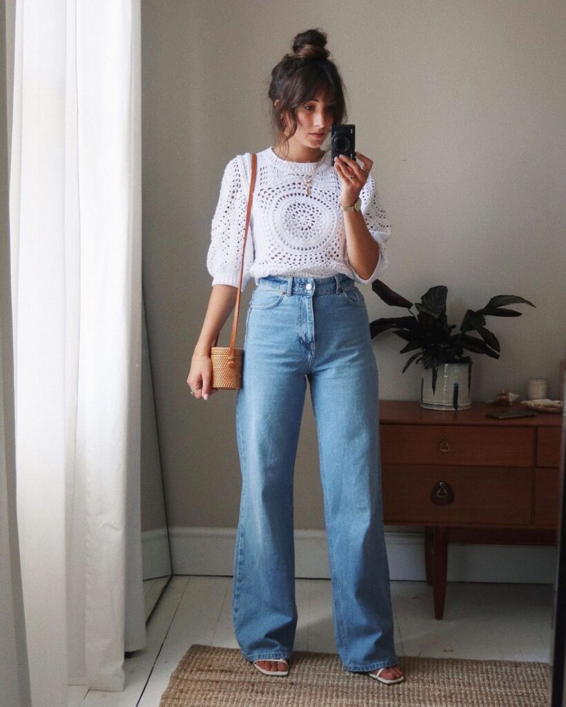 Woman wearing wide-legged jeans with a boho top