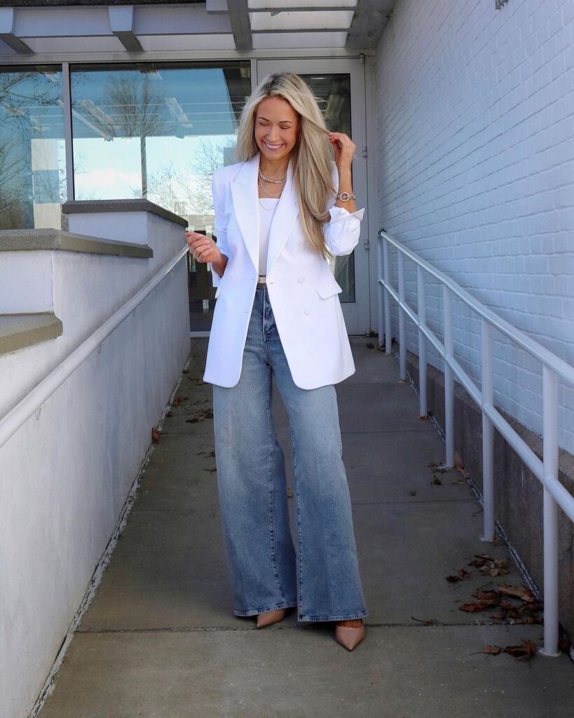 Woman wearing wide-legged jeans with a blazer