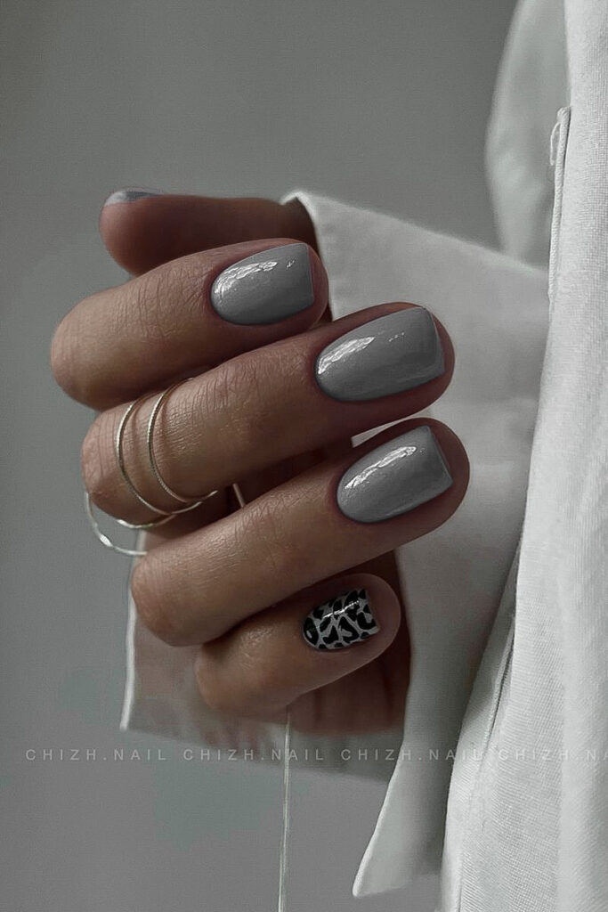 woman's hand with moody gray manicure