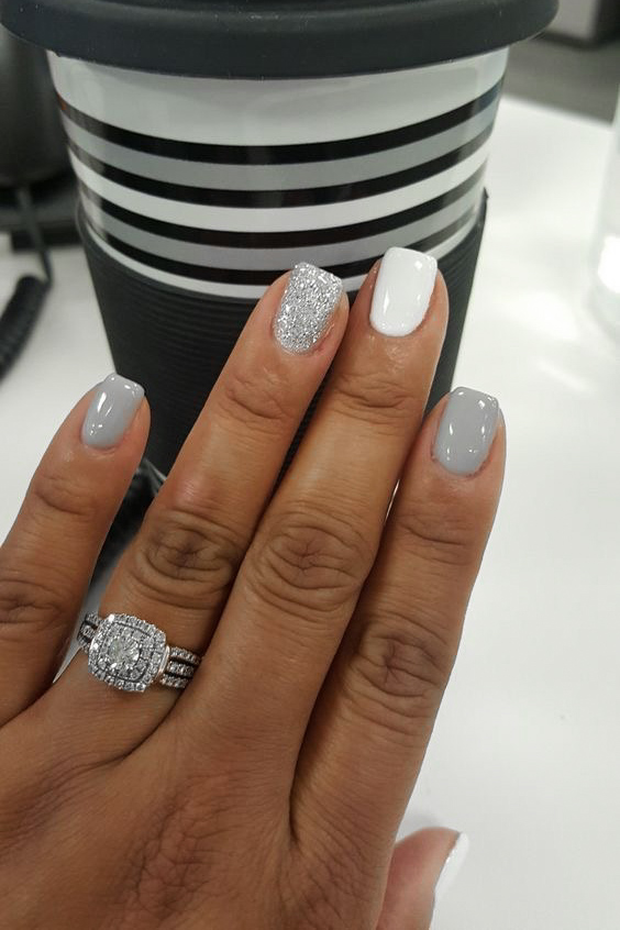 woman's hand with moody gray manicure