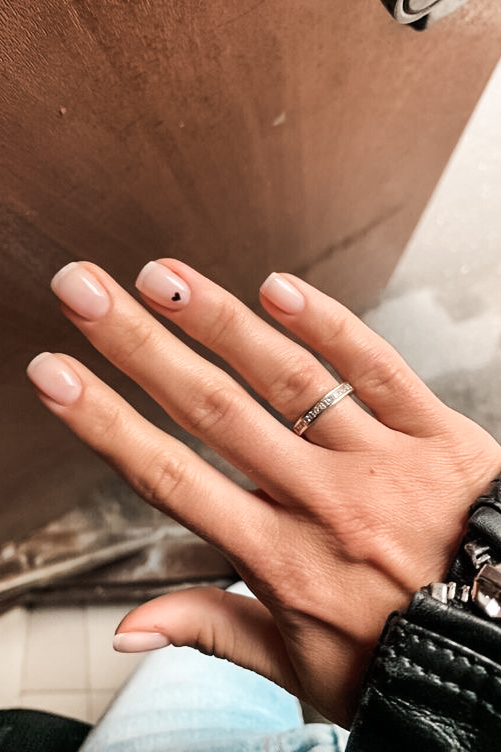 Neutral nail with tiny heart design for Valentine's Day