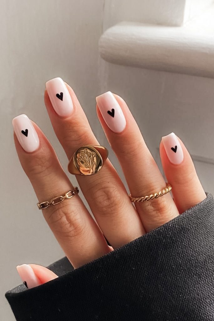 Neutral nail with tiny heart design for Valentine's Day