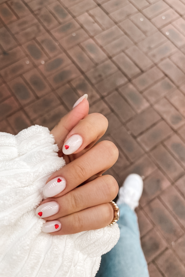 Neutral nail with tiny heart design for Valentine's Day